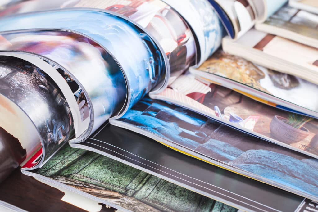 Stack of open magazines