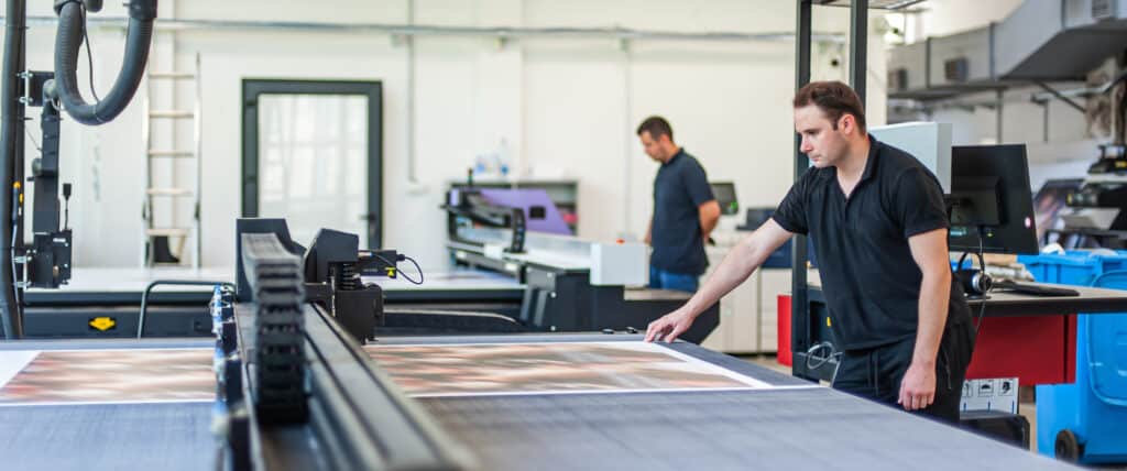 Flatbed printer printing signs for business